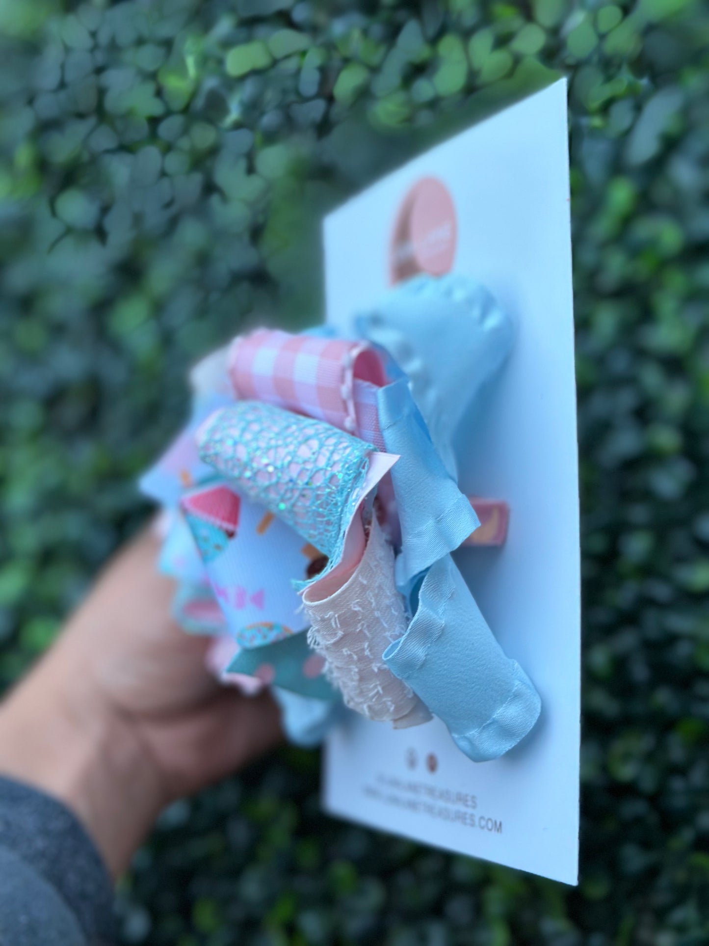 Introducing our Cupcake middle knot Ruffle Hair Bow. This ruffle ribbon hair bow is about 5 inches wide and made from high-quality grosgrain, glitter, plaid, and ruffle ribbon. Perfect for any little girl who loves big bows, attached to an alligator clip or nylon headband.