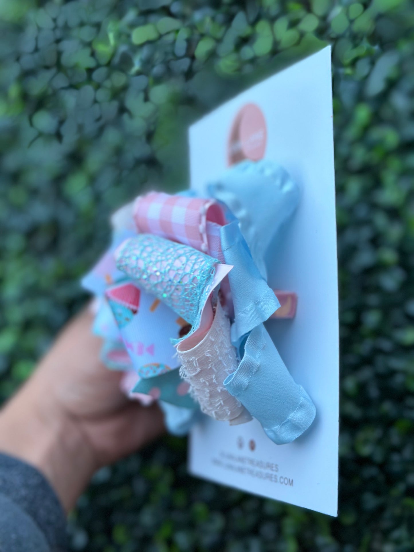 Introducing our Cupcake middle knot Ruffle Hair Bow. This ruffle ribbon hair bow is about 5 inches wide and made from high-quality grosgrain, glitter, plaid, and ruffle ribbon. Perfect for any little girl who loves big bows, attached to an alligator clip or nylon headband. 